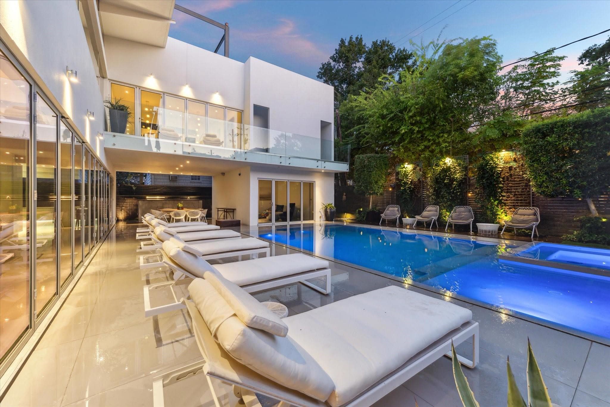 Pool deck and loungers at dusk